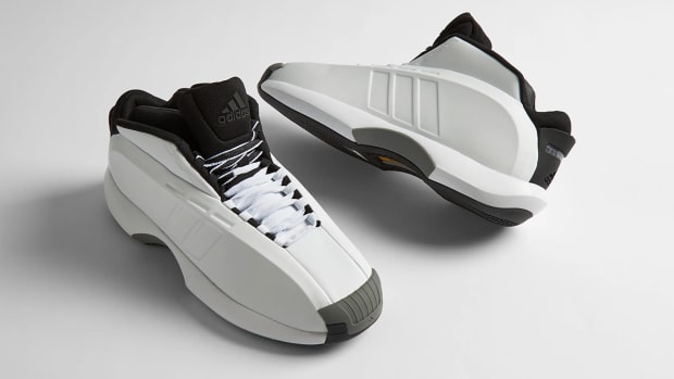 Side view of Kobe Bryant's white and black adidas shoes.